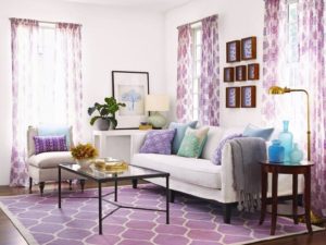 living room with purple carpet and drapes