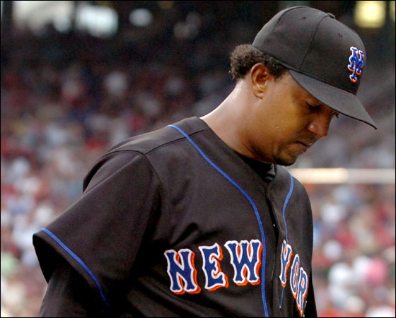 Pedro looked disappointed as he walked to the dugout after giving up four runs in the first inning.