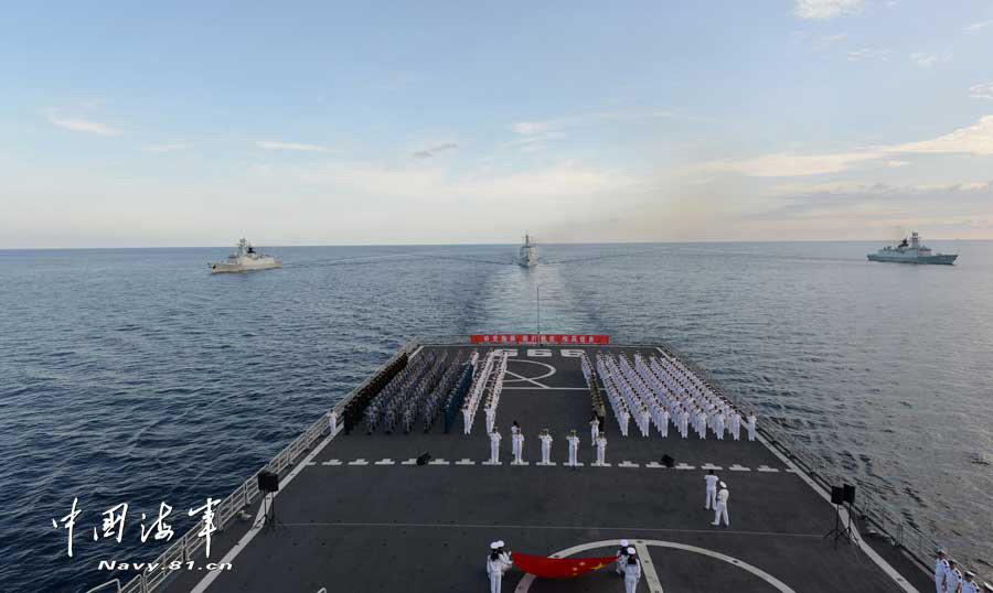 The combat-readiness cruise and high-sea training taskforce under the South China Sea Fleet of the Navy of the Chinese People's Liberation Army (PLA) arrived at the waters off the Zengmuansha Reef of the Nansha Islands and held a grand oath-taking ceremony on March 26, 2013.(chinamil.com.cn/Qian Xiaohu and Song Xin)
