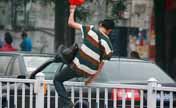 Thrilling hurdlers in street during rush hour
