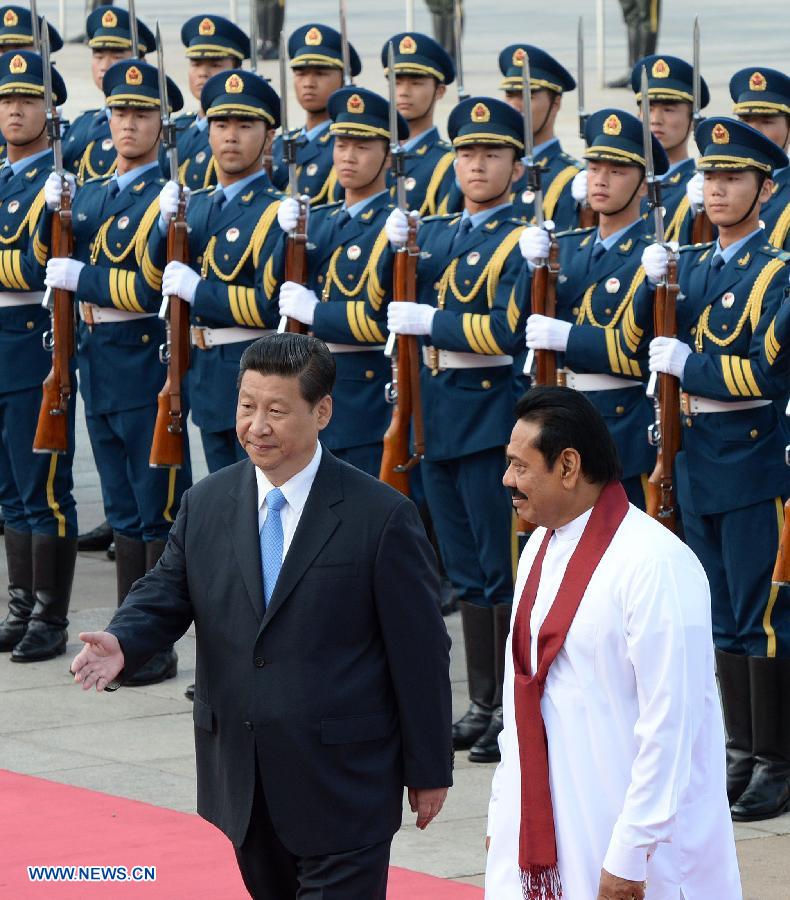 Chinese President Xi Jinping (L, front) holds a welcoming ceremony for President of Sri Lanka Mahinda Rajapakse in Beijing, capital of China, May 28, 2013. (Xinhua/Liu Jiansheng) 

