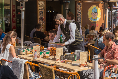 Outdoor cafe with pretzels hanging on every table