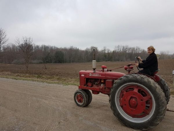 Debbie driving tractor