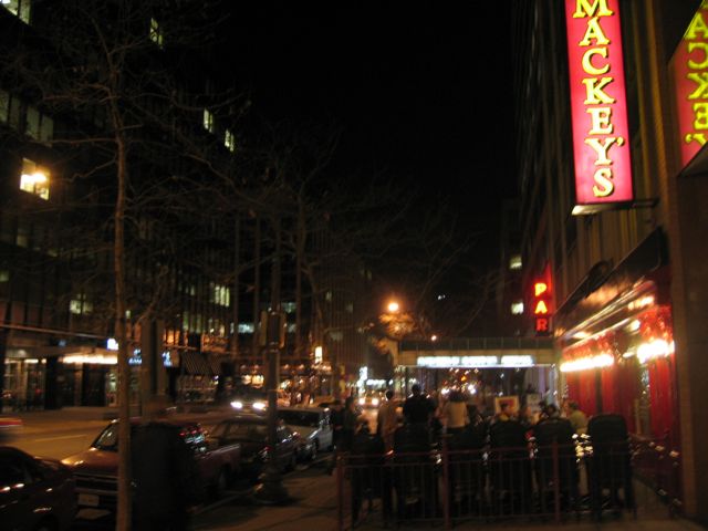 People eating outside on the sidewalk a week ago at Mackey's, a downtown D.C. bar.