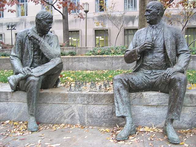 Sculpture of two men playing chess between federal court and the Canadian embassy.