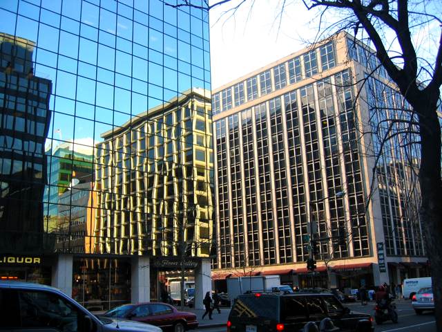 Building reflections merge into real buildings on 17th St.