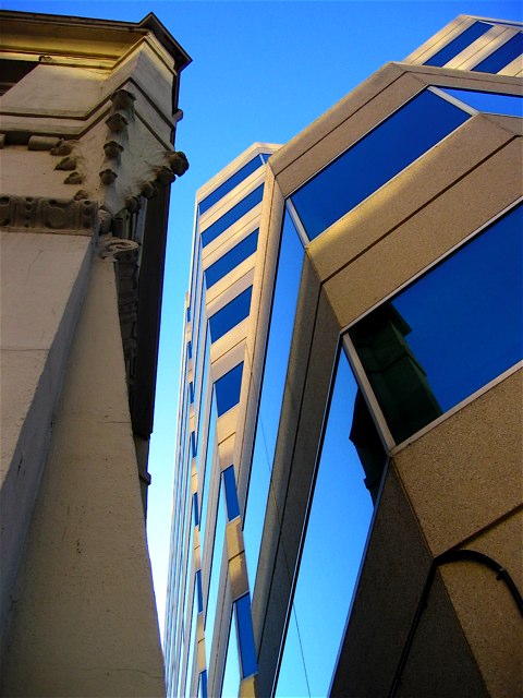 An old cathedral next to a new office building on 20th St. NW.