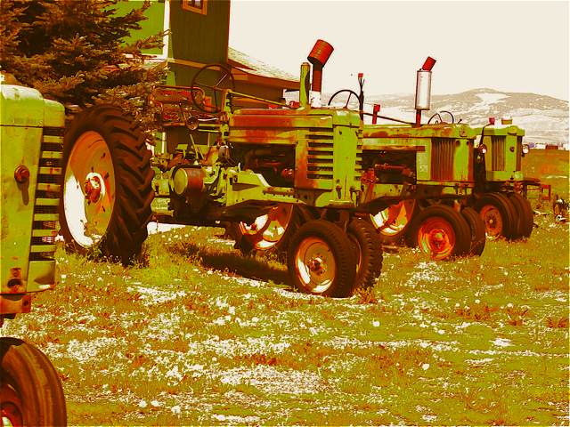 A line of John Deere tractors just outside Deer Lodge, Montana.