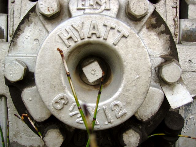 The hub of one of the wheels on the train engine