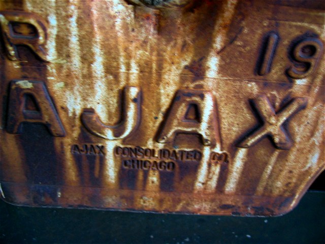 A rusted part on one of the train cars.