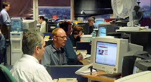 Journalists at work in the BBC News Online production centre in London