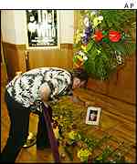 Fans lay flowers outside the venue where The Who were due to play 