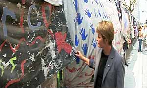 Mary Williamson views the artwork at a shrine near Ground Zero