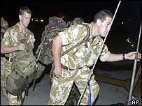 British soldiers board a transport plane to take them from Cyprus to Basra, Iraq 