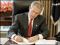 US President George W Bush signs a series of executive orders on 27 August 2004