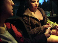 Client handing over money to a prostitute