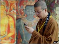 Monk using mobile, AFP/Getty