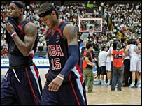 LeBron James (left) and Carmelo Antony leave the court as the Greeks celebrate