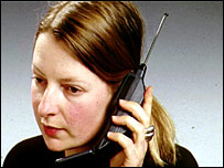 Woman with old mobile phone