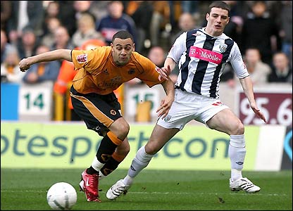 Wolves' Craig Davies and West Brom's Jason Koumas in action in the early stages 