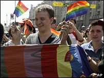 Gay rights activists waving rainbow flags