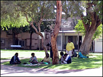 Aboriginal people gather in a street in Alice Springs (file image)