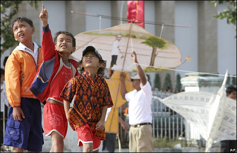 Cambodian children watching kite-flying in Phnom Penh. 