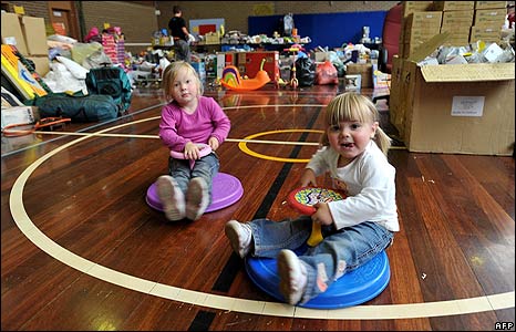 Imogen and Mya Roberts, of Kinglake, play among a sea of donated goods