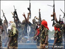 Members of Mend fire their weapons