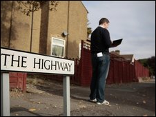 TalkTalk engineer in road with laptop