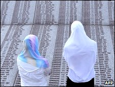 Bosnian Muslim survivors of the Srebrenica massacre search for names of their relatives (file image)