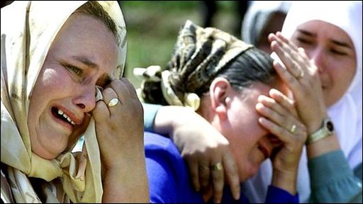 Women crying at Srebrenica memorial service