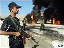 Burning trucks in Balochistan province, Pakistan, following an attack by suspected Taliban militants