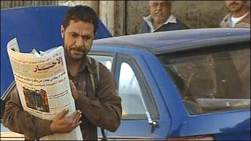 An Iraqi newspaper salesman