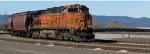 BNSF 5216 pusher butted up against BNSF 478105 covered hopper 