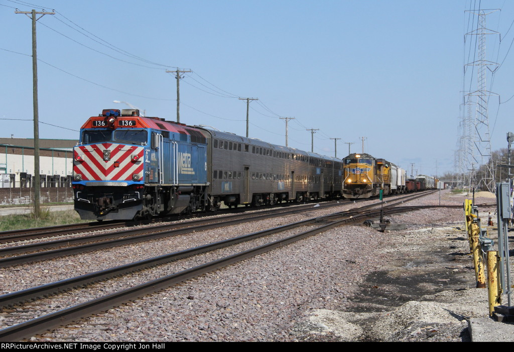 METX 136 shoves away east as it meets a westbound UP freight