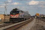 METX 423 leads an express west for Elgin