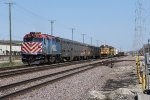 METX 136 shoves away east as it meets a westbound UP freight