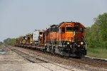 BNSF 2129 & 2002 bring a train of track equipment east