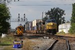 The hottest train on the railroad, Q010 races east through West Deshler