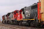 A long Westbound mixed freight with autoracks  tank cars and boxcars