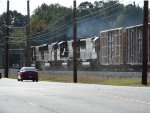 Two SD70M's and a SD60E are working hard, sanders going, as they roll east at MP 536