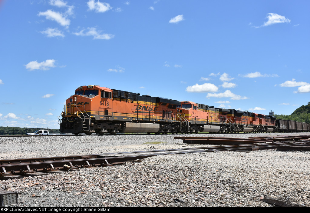 BNSF 6418 Leads a empty coal up the k. 