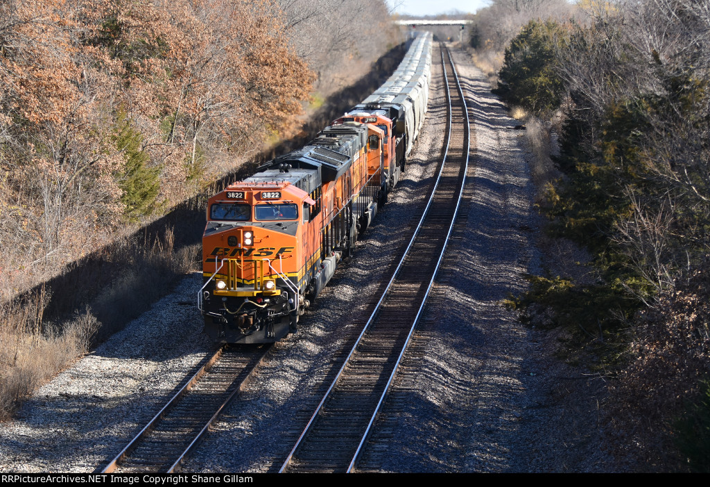 BNSF 3822 Tops the hill with a sand train in tow.