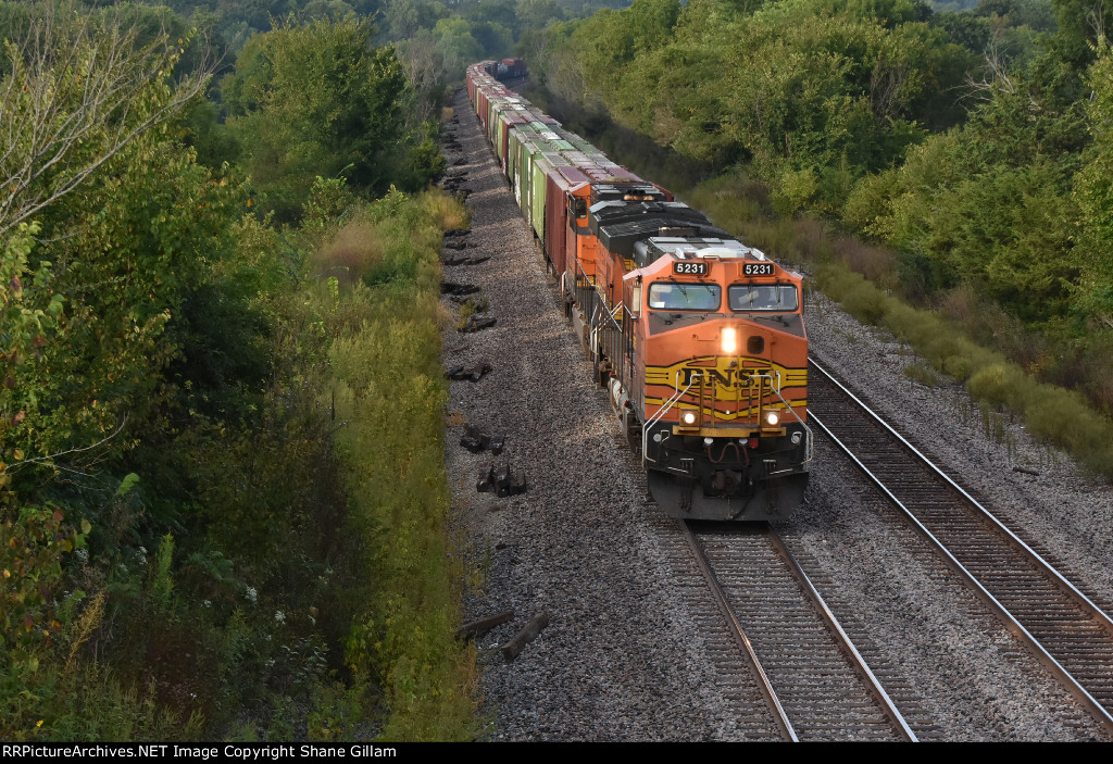 BNSF 5231 Races a freight toward Gibbs Mo. 