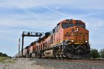 BNSF 7194 Screams under a Santa Fe signal bridge. 