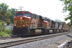 BNSF 7676 leads a Med Shipping train