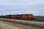 BNSF 6111 25th Anniversary unit leads a westbound freight.