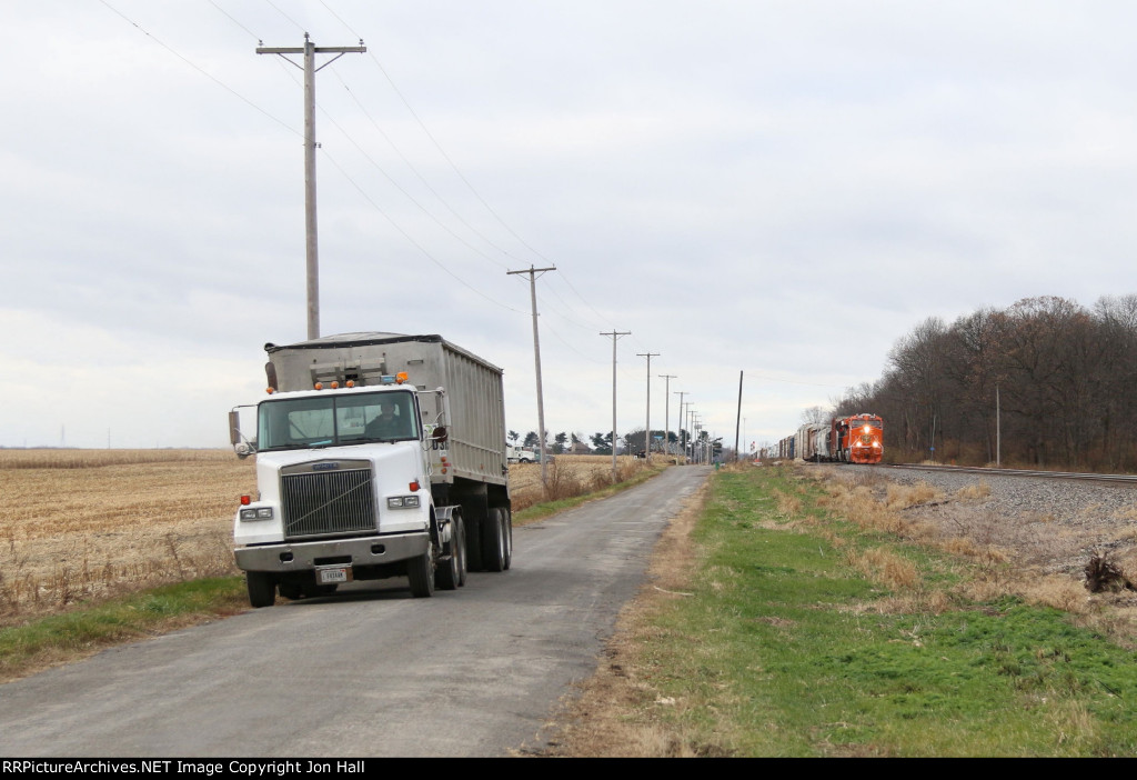 As a grain truck hauls out some of the last part of the harvest, A492 approaches on the South Bend Sub