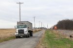 As a grain truck hauls out some of the last part of the harvest, A492 approaches on the South Bend Sub